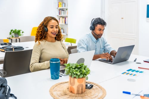 Preview: Customer service representatives wearing headsets providing online support