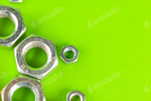 Preview: Engineering tools. Bolts and nuts on green background