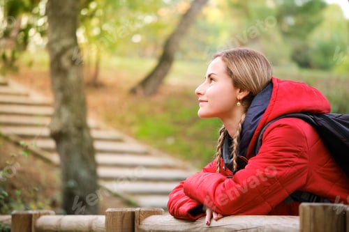 Preview: Hiker contemplating views in the forest.