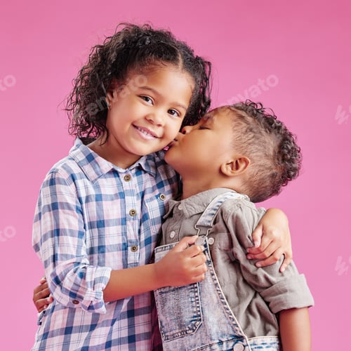 Preview: Two children only posing and being affectionate against a pink copyspace background. African Americ