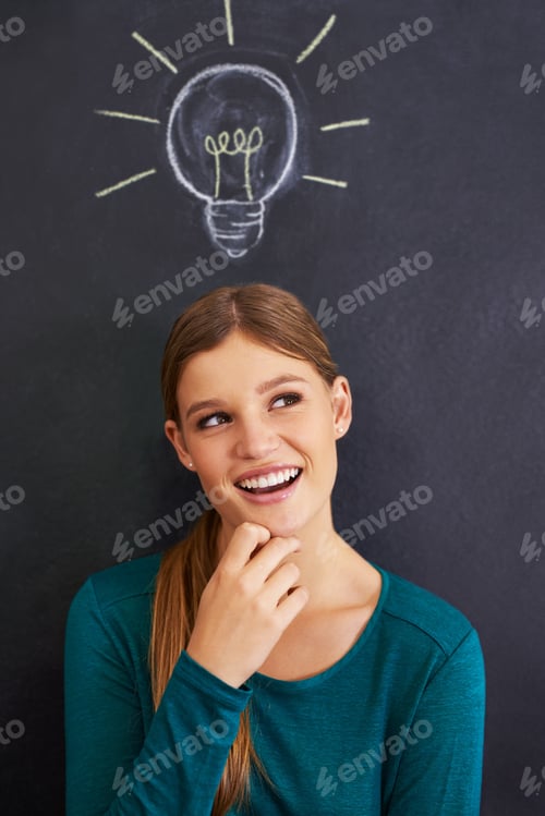 Preview: Cropped shot of an attractive young woman standing in front of a blackboard