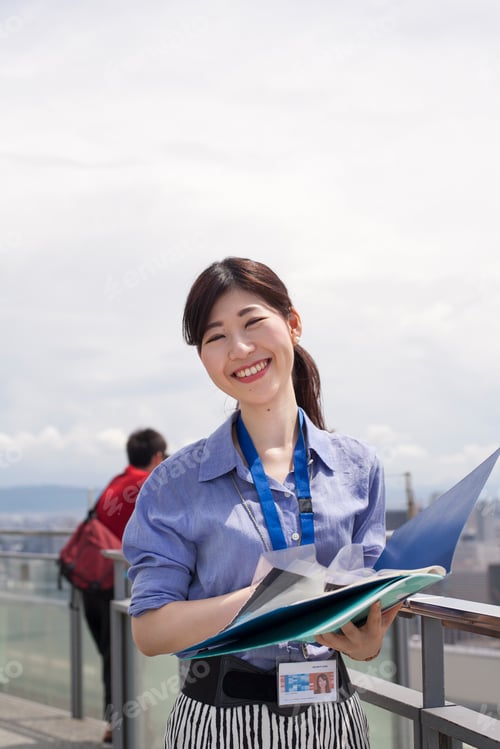 Preview: A working woman on a balcony.