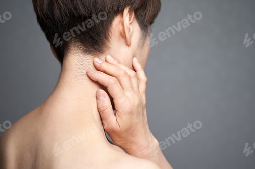 Preview: Middle-aged Japanese woman holding down her aching neck
