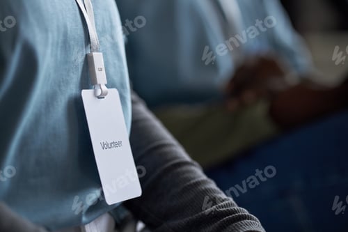 Preview: Wearing Volunteer Badge for Charity Event