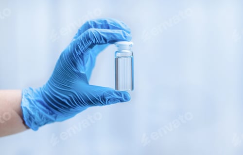 Preview: Doctor's hand in a medical glove with an ampoule in a medical hospital.