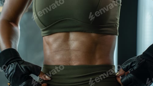 Preview: Beautiful young Girl weight training with dumbbells at Gym. Sport, healthy lifestyle.