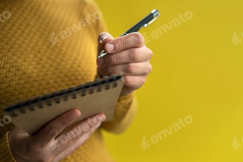 Preview: Woman Writing by left hand in notepad