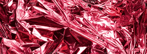 Preview: Shiny metallic texture. Viva Magenta abstract background. Trending color of 2023. copy space banner