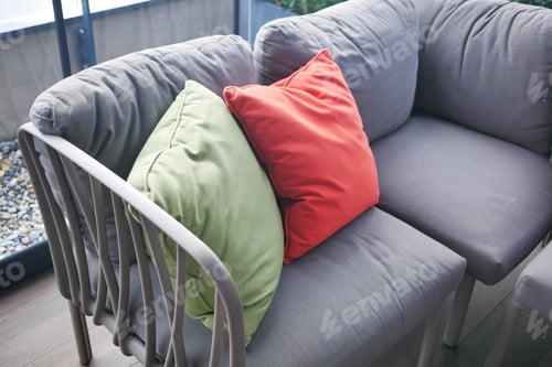 Preview: modern grey sofa with pillows in living room at home