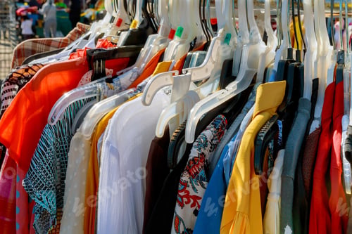 Preview: fashion clothing on hangers at the show