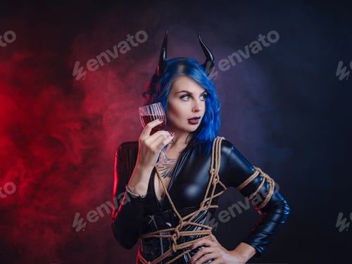 Preview: happy halloween, woman in devil costume