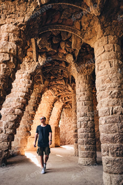 Preview: Young man walking under tunnel