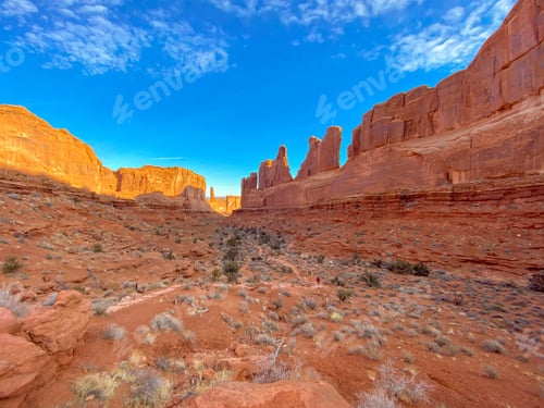 Preview: Park Avenue Viewpoint in Arches national park with a blue sky.