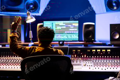 Preview: Sound designer counting down for artist to sing in sound booth