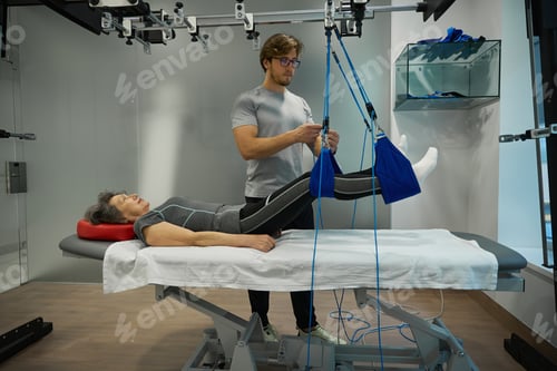 Preview: Elderly patient on a harness under the supervision of specialist