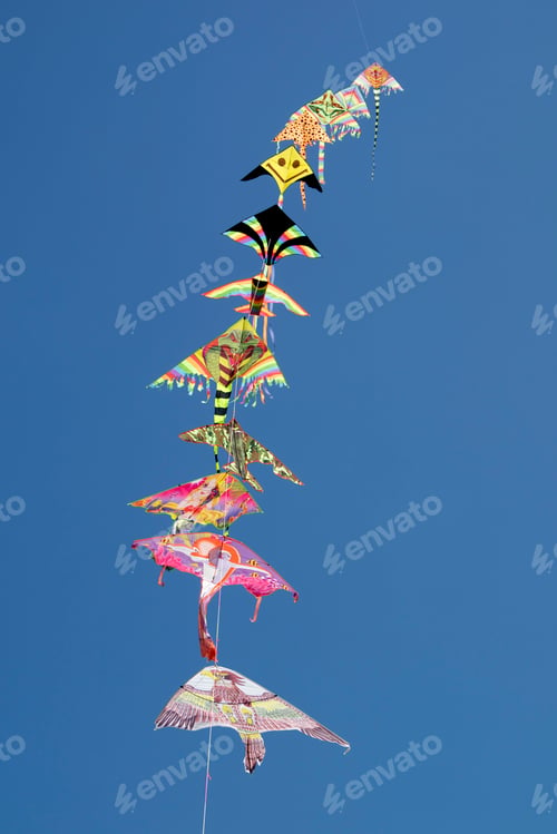 Preview: Series of colorful kites flying in the blue sky
