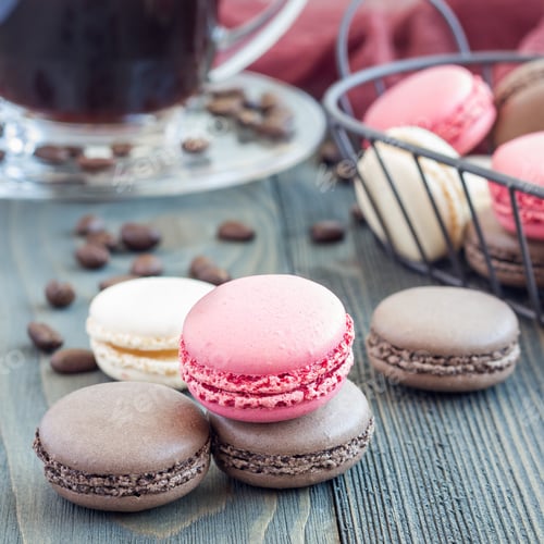 Preview: Different kinds of colorful french dessert macaron, served with coffee, square