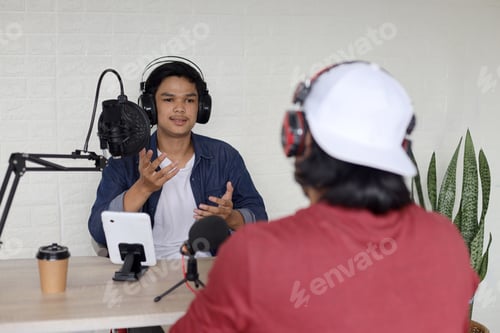 Preview: Young Asian businessman on radio podcast