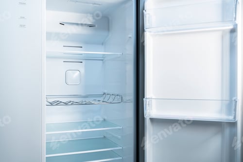 Preview: Empty refrigerator with open door Inside an empty, clean refrigerator