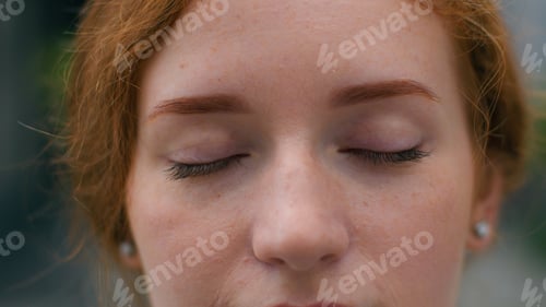 Preview: Close up beautiful smiling young Caucasian ginger woman face female lady girl slowly wide opening