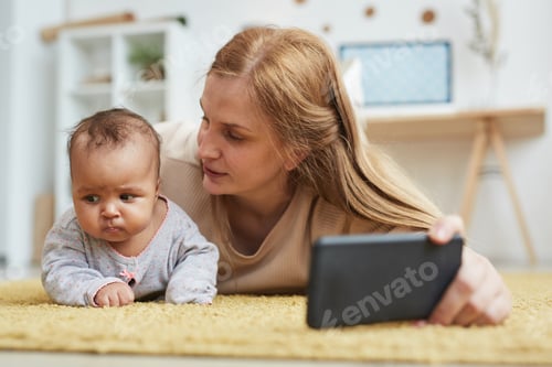 Preview: Loving Mother Taking Selfie Photo with Baby