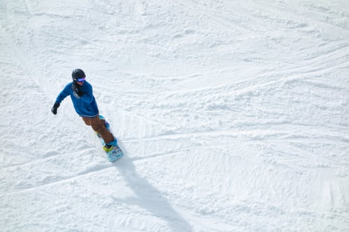 Preview: Snowboarder Carving Through Fresh Powder on Sunny Day