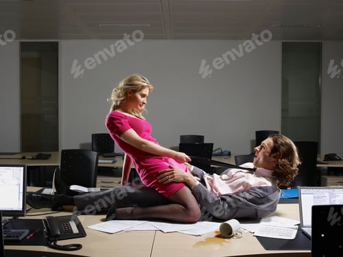 Preview: A couple embrace on an office table