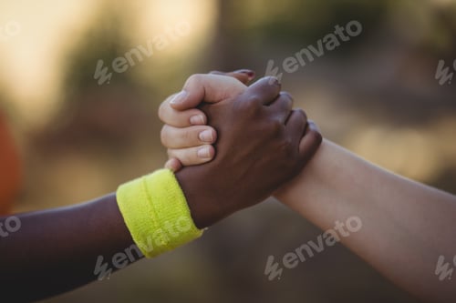 Preview: Close-up of athlete holding hands during obstacle course