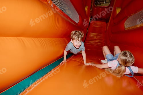 Preview: Kids playing on soft leather slide