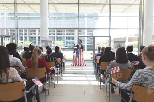 Preview: Front view of Caucasian businessman speaking at a business seminar in office building