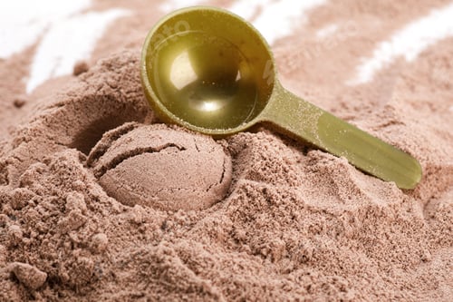 Preview: Closeup of scoop with a chocolate protein powder