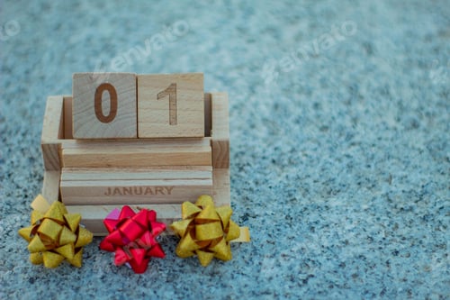 Preview: Vintage wooden calendar with New Year's date and colorful Christmas gift bows.