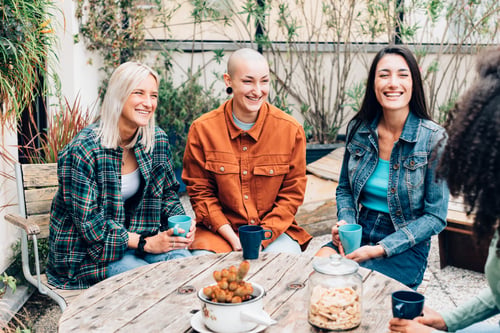 Preview: group of young street fashion stylish ladies talking together
