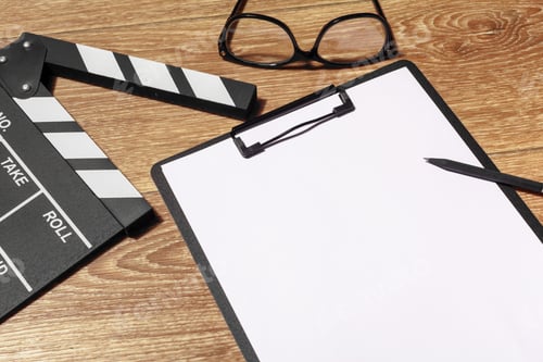 Preview: Film clapper board on a table