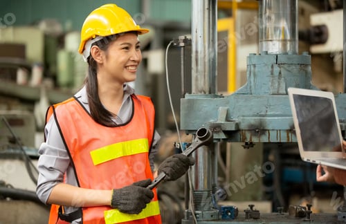 Preview: Young woman working in a workshop as artisan manual worker