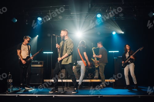 Preview: Music band performing live on stage during a concert