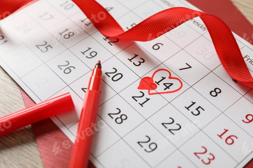 Preview: Calendar with marked Valentine's Day, red ribbon and marker on wooden table, closeup