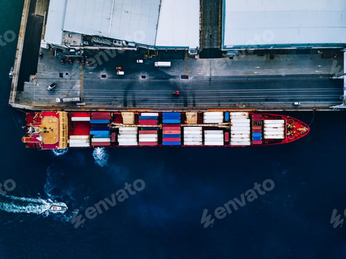 Preview: Aerial top view of industrial cargo container ship in terminal in Italy