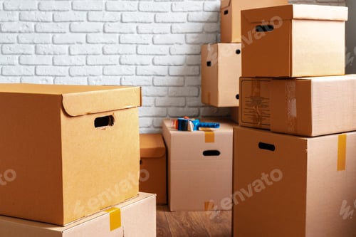 Preview: Close up of moving carton boxes in an empty room