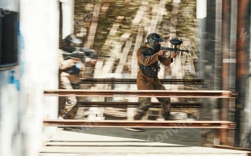 Preview: Paintball, battlefield and team, motion blur and attack with target, soldier with gun and fight. Po