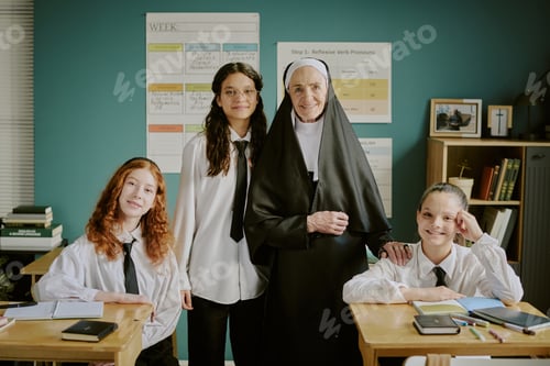 Preview: Portrait of Smiling Nun with Three Schoolchildren at Desks