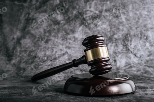 Preview: wooden judges gavel on table in a courtroom or enforcement office.