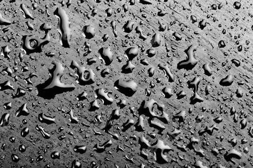 Preview: water drops splash on the black floor