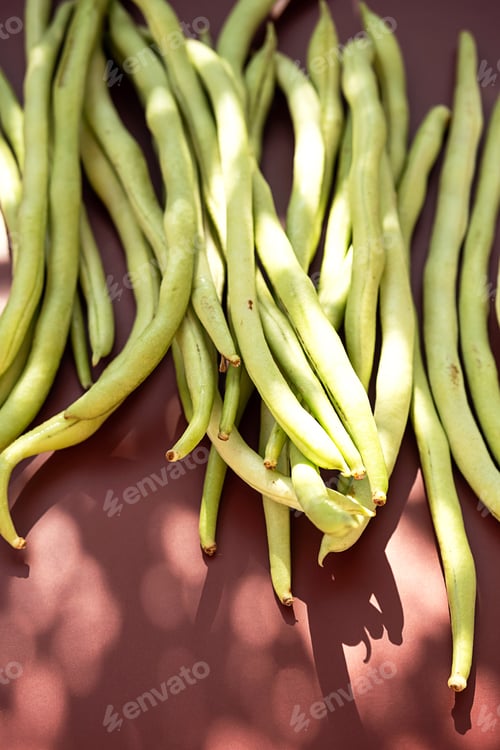 Preview: Some string beans on garden table. Home grown organic veggies.