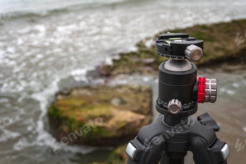 Preview: Professional tripod on a rock by the sea
