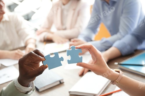 Preview: People with puzzle indoors, closeup of hands. Unity concept