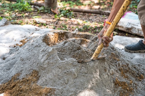 Preview: Manual concrete mixing with sand, cement and water, using shovel and trowel on outdoors