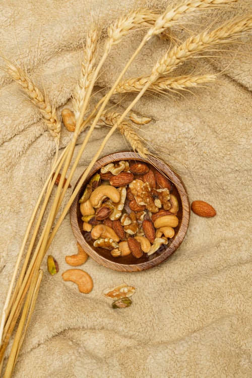 Preview: Bowl of Nuts and Wheat on Soft Cloth