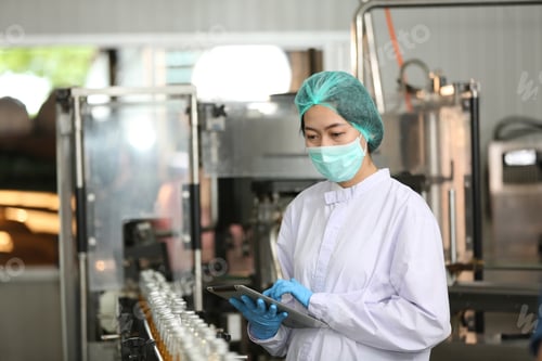 Preview: Drink production, employee works at beverage manufacturing, quality checking production line.
