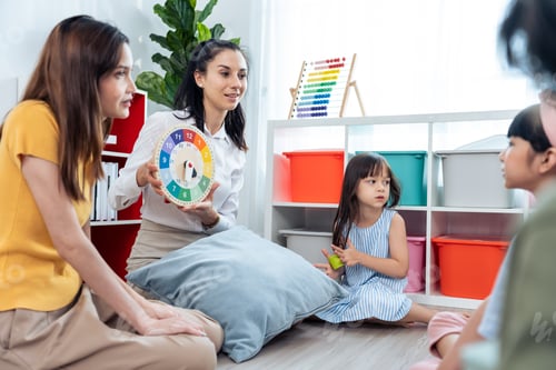 Preview: Caucasian beautiful woman teacher teaching a lesson to kid at school.